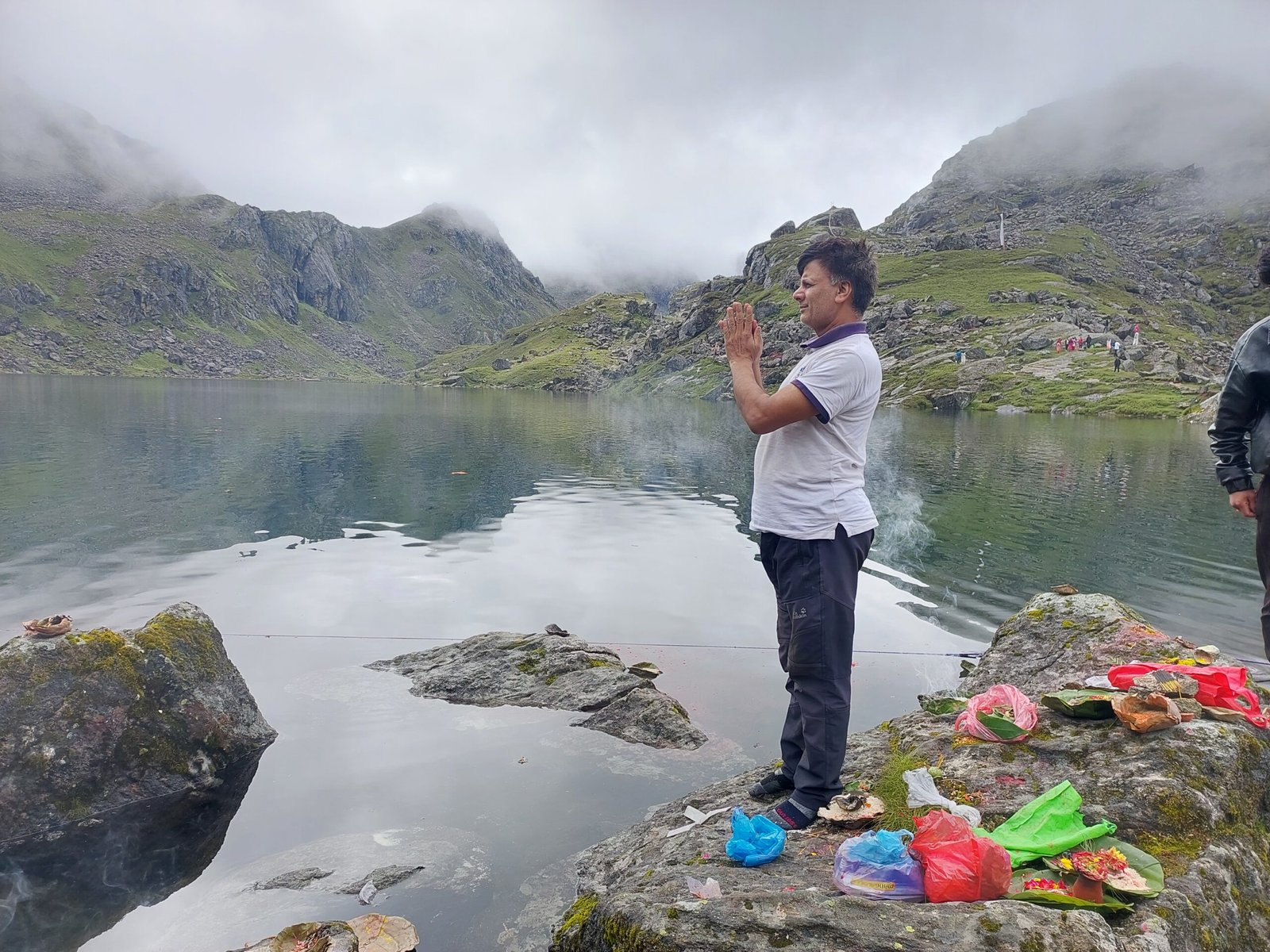 Pilgrims performing Namaste and puja at Gosainkunda Lake during Janai Purnima Festival, Nepal