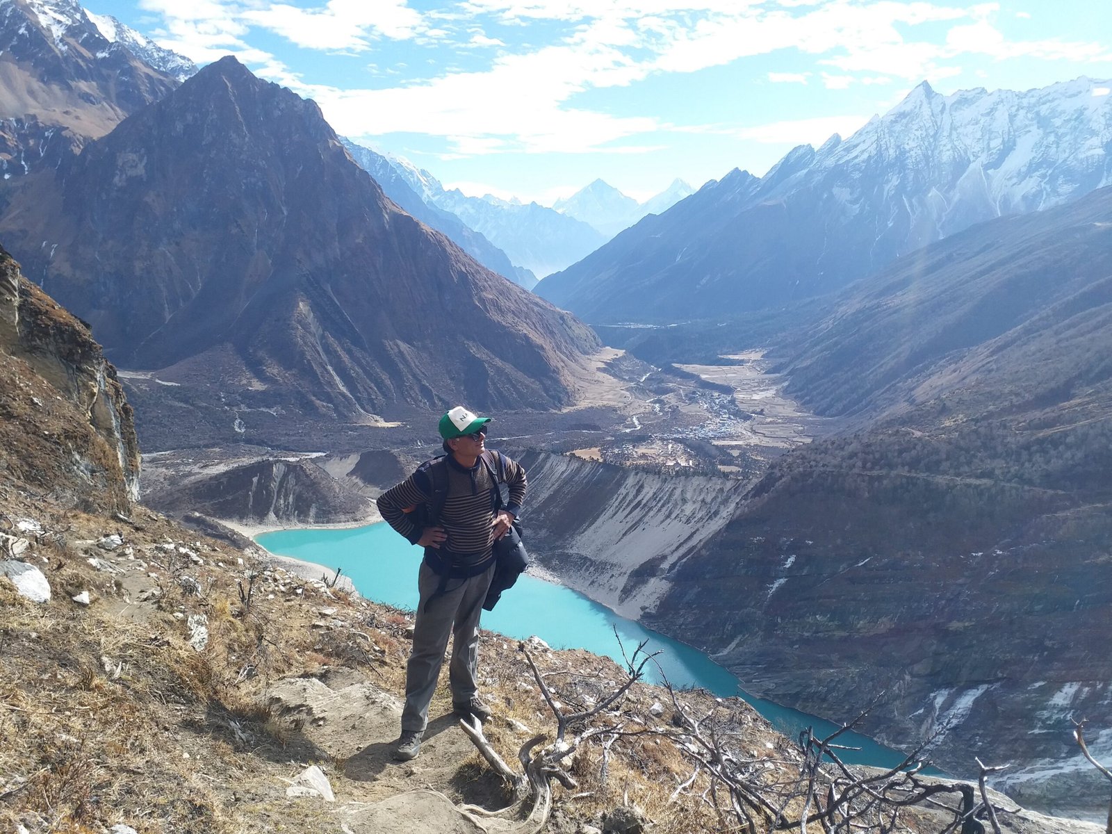 Trekkers enjoying the view of Birendra Tal and Sasagaun Valley during an acclimatization day and day trip to Manaslu Base Camp on the Manaslu Circuit Trek, Nepal